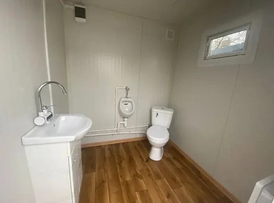 Contenedor sanitario WC Box 2x2 m con cabina doble – módulo prefabricado compacto con doble acceso para obra