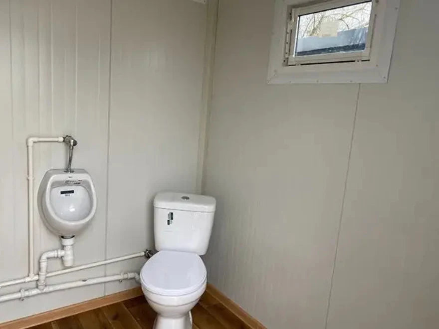 Contenedor sanitario WC Box 2x2 m con cabina doble – módulo prefabricado compacto con doble acceso para obra